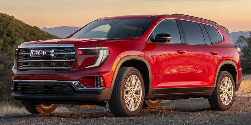 GMC Acadia in red exterior with bold grille