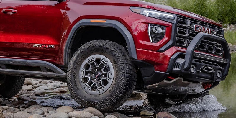 GMC Canyon splashing through shallow water