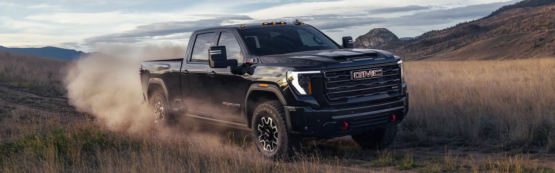 GMC Sierra 2500 HD in a rugged field landscape